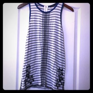Grey and white stripped shirt with embroidery.